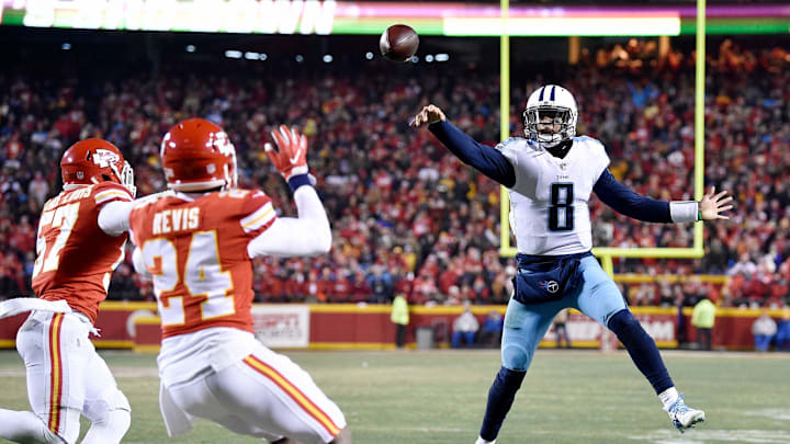 Tennessee Titans quarterback Marcus Mariota (8) passes on a play that was deflected and ultimately caught by Mariota, leading to his touchdown during the second half at Arrowhead Stadium Jan. 6, 2018 against the Kansas City Chiefs. The Titans won the AFC Wild Card playoff 22-21.
