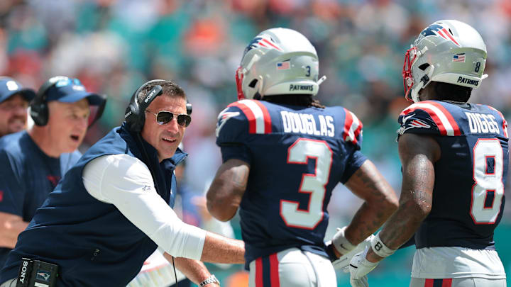 Sep 14, 2025; Miami Gardens, Florida, USA; New England Patriots head coach Mike Vrabel celebrates with wide receiver DeMario Douglas (3) and wide receiver Stefon Diggs (8) against the Miami Dolphins during the first quarter at Hard Rock Stadium. Mandatory Credit: Sam Navarro-Imagn Images