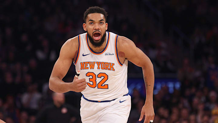 Jan 27, 2025; New York, New York, USA; New York Knicks center Karl-Anthony Towns (32) reacts after makes a three point basket during the first half against the Memphis Grizzlies at Madison Square Garden. Mandatory Credit: Vincent Carchietta-Imagn Images
