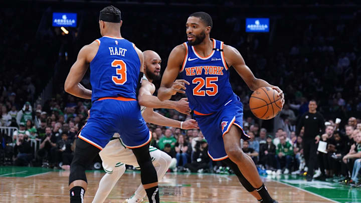 New York Knicks forward Mikal Bridges drives the ball against Boston Celtics guard Derrick White. Mandatory Credit: David Butler II-Imagn Images