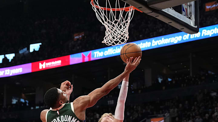 Jan 6, 2025; Toronto, Ontario, CAN; Milwaukee Bucks forward Giannis Antetokounmpo (34) drives to the basket as Toronto Raptors guard Gradey Dick (1) defends during the second quarter at Scotiabank Arena. Mandatory Credit: Nick Turchiaro-Imagn Images