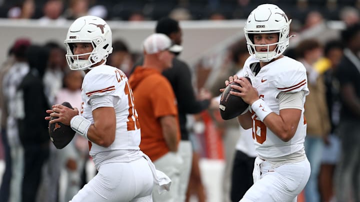 Texas Longhorns quarterbacks Matthew Caldwell (18) and Arch Manning (16) drop back to pass. Texas Longhorns quarterbacks Matthew Caldwell (18) and Arch Manning (16) drop back to pass.