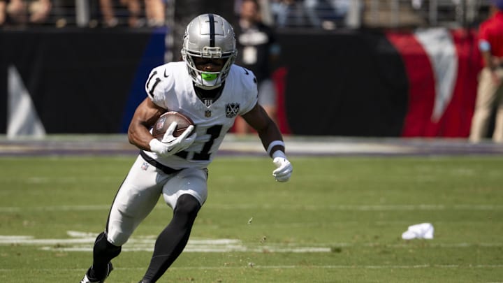 Sep 15, 2024; Baltimore, Maryland, USA;  Las Vegas Raiders wide receiver Tre Tucker (11) runs after the catch during the first quarter against the Baltimore Ravens at M&T Bank Stadium. Mandatory Credit: Tommy Gilligan-Imagn Images