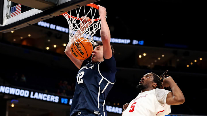 Mar 22, 2024; Memphis, TN, USA;  Longwood Lancers center Szymon Zapala (12) dunks the ball against