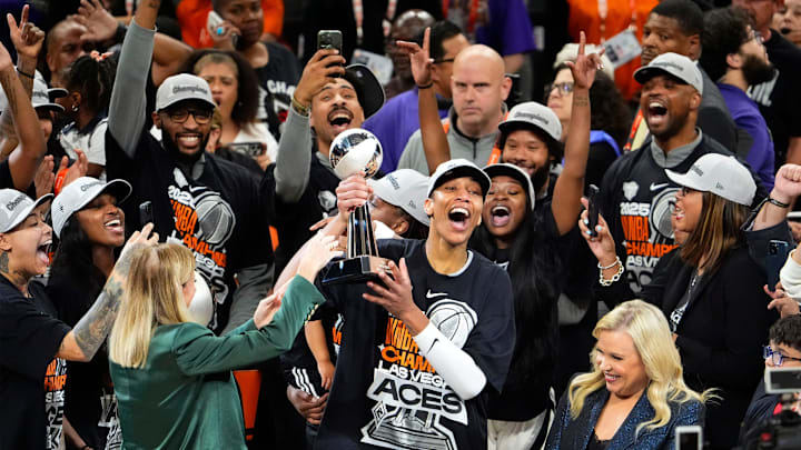 Las Vegas Aces center A'ja Wilson (22) celebrates as she receives the MVP trophy after defeating the Phoenix Mercury 97-86 to win the WNBA Championship in a four-game sweep in Game Four of the WNBA Finals at Mortgage Matchup Center -