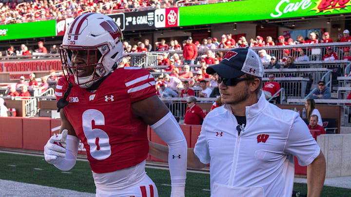 Wisconsin cornerback Xavier Lucas (6) is escorted by a member of the training staff during the fourth quarter of their game against South Dakota Saturday, September 7 , 2024 at Camp Randall Stadium in Madison, Wisconsin.