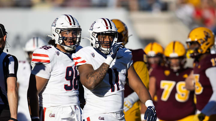 Nov 25, 2023; Tempe, Arizona, USA; Arizona Wildcats edge Taylor Upshaw (11) and defensive lineman Tiaoalii Savea (98) against the Arizona State Sun Devils during the Territorial Cup at Mountain America Stadium. Mandatory Credit: Mark J. Rebilas-USA TODAY Sports