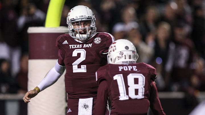 Nov 2, 2013; College Station, TX, USA; Texas A&M Aggies quarterback Johnny Manziel (2) is congratulated by wide receiver Edward Pope (18) after scoring a rushing touchdown during the third quarter UTEP Miners at Kyle Field. Mandatory Credit: Troy Taormina-Imagn Images