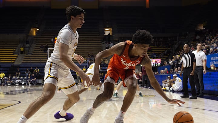 Jan 11, 2025; Berkeley, California, USA; Virginia Tech Hokies guard Rodney Brown Jr. (4) loses control of the ball against California Golden Bears guard Andrej Stojakovic (2) during the first half at Haas Pavilion. Mandatory Credit: D. Ross Cameron-Imagn Images Jan 11, 2025; Berkeley, California, USA; Virginia Tech Hokies guard Rodney Brown Jr. (4) loses control of the ball against California Golden Bears guard Andrej Stojakovic (2) during the first half at Haas Pavilion. Mandatory Credit: D. Ross Cameron-Imagn Images