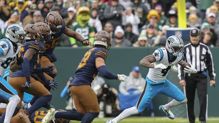 Nov 2, 2025; Green Bay, Wisconsin, USA; Carolina Panthers wide receiver Tetairoa McMillan (4) runs the ball after making a reception against the Green Bay Packers during the game at Lambeau Field. Mandatory Credit: Tork Mason-USA TODAY Network via Imagn Images