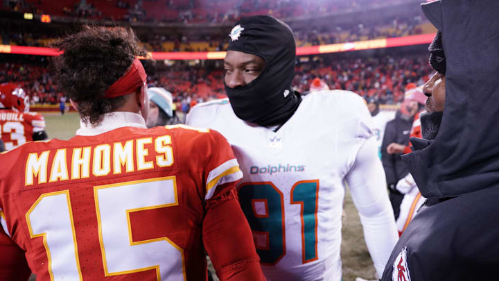 Jan 13, 2024; Kansas City, Missouri, USA; Kansas City Chiefs quarterback Patrick Mahomes (15) meets with Miami Dolphins defensive end Emmanuel Ogbah (91) following the 2024 AFC wild card game at GEHA Field at Arrowhead Stadium. Mandatory Credit: Denny Medley-Imagn Images