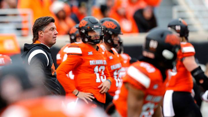 Nov 25, 2023; Stillwater, Oklahoma, USA; Oklahoma State head football coach Mike Gundy watches
