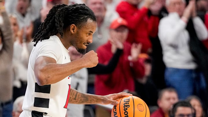 Cincinnati Bearcats guard Day Day Thomas (1) pumps his fist as time expires in the second half of the NCAA Big 12 basketball game between the Cincinnati Bearcats and the Iowa State Cyclones at Fifth Third Stadium in Cincinnati on Saturday, Jan. 17, 2026. The Bearcats upset the No. 2 Cyclones, winning 79-70.