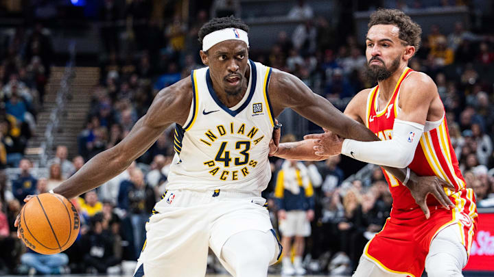 Feb 1, 2025; Indianapolis, Indiana, USA; Indiana Pacers forward Pascal Siakam (43) dribbles the ball against Atlanta Hawks guard Trae Young (11) in the second half at Gainbridge Fieldhouse. Mandatory Credit: Trevor Ruszkowski-Imagn Images