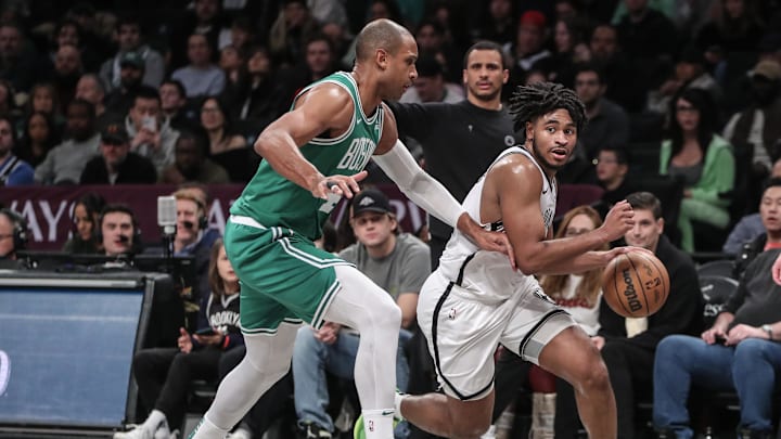 Feb 13, 2024; Brooklyn, New York, USA;  Brooklyn Nets guard Cam Thomas (24) drives past Boston Celtics center Al Horford (42) in the fourth quarter at Barclays Center. Mandatory Credit: Wendell Cruz-Imagn Images