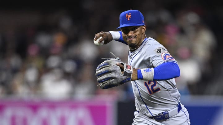 Aug 22, 2024; San Diego, California, USA; New York Mets shortstop Francisco Lindor (12) throws to first base during the sixth inning against the San Diego Padres at Petco Park. Mandatory Credit: Orlando Ramirez-USA TODAY Sports