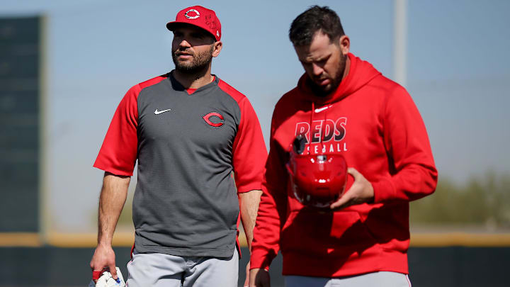 Cincinnati Reds first baseman Joey Votto (19), left, and second baseman Mike Moustakas (9). Cincinnati Reds first baseman Joey Votto (19), left, and second baseman Mike Moustakas (9).