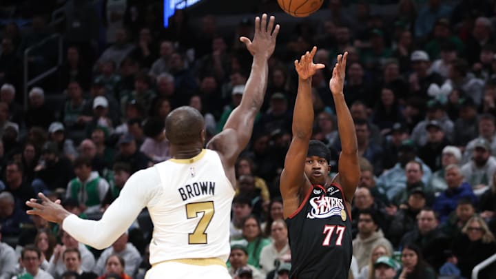 Mar 1, 2026; Boston, Massachusetts, USA; Philadelphia 76ers guard VJ Edgecombe (77) shoots over Boston Celtics forward Jaylen Brown (7) during the first half at TD Garden. Mandatory Credit: Paul Rutherford-Imagn Images