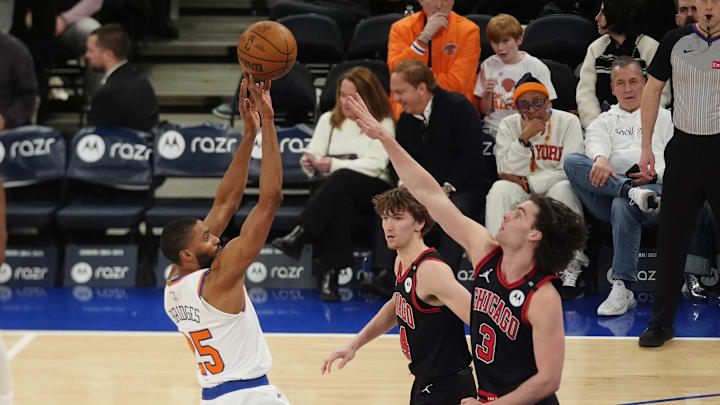 Feb 20, 2025; New York, New York, USA; New York Knicks small forward Mikal Bridges (25) shoots a jump shot against Chicago Bulls shooting guard Josh Giddey (3) during the second half at Madison Square Garden. Mandatory Credit: Gregory Fisher-Imagn Images