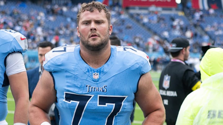 Oct 19, 2025; Nashville, Tennessee, USA; Tennessee Titans offensive tackle Peter Skoronski (77) walks off the field against the New England Patriots during pre-game warmups at Nissan Stadium. Mandatory Credit: Steve Roberts-Imagn Images Oct 19, 2025; Nashville, Tennessee, USA; Tennessee Titans offensive tackle Peter Skoronski (77) walks off the field against the New England Patriots during pre-game warmups at Nissan Stadium. Mandatory Credit: Steve Roberts-Imagn Images