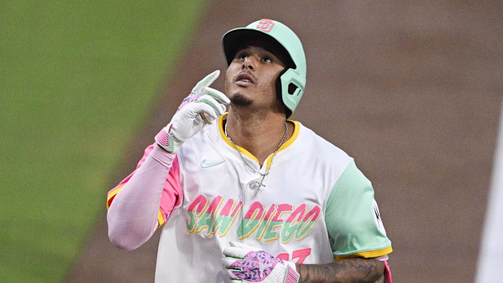 Sep 12, 2025; San Diego, California, USA; San Diego Padres third baseman Manny Machado (13) points skyward after hitting a solo home run during the first inning against the Colorado Rockies at Petco Park. Mandatory Credit: Denis Poroy-Imagn Images Sep 12, 2025; San Diego, California, USA; San Diego Padres third baseman Manny Machado (13) points skyward after hitting a solo home run during the first inning against the Colorado Rockies at Petco Park. Mandatory Credit: Denis Poroy-Imagn Images