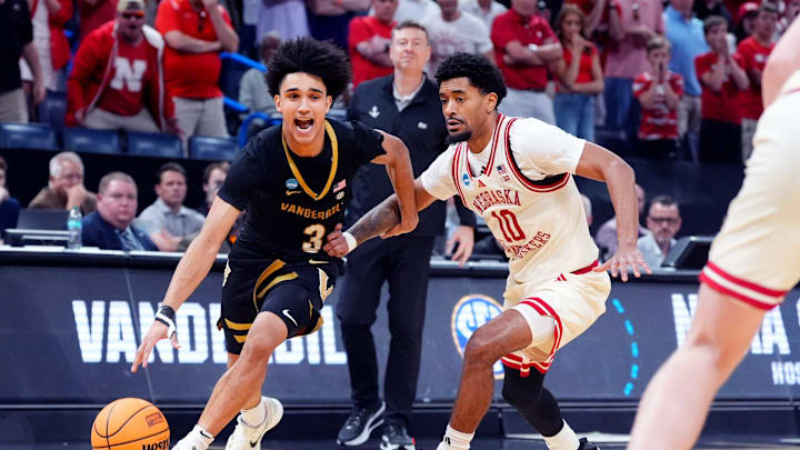 Vanderbilt's Tyler Tanner (3) dries to the basket as Nebraska's Jamarques Lawrence (10) defends during a second-round game in the NCAA men's basketball tournament between Nebraska Cornhuskers and Vanderbilt Commodores at Paycom Center in Oklahoma City, Saturday March 21, 2026.