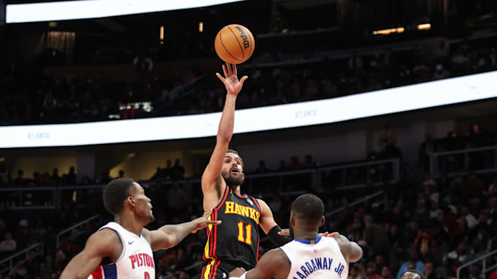Feb 23, 2025; Atlanta, Georgia, USA; Atlanta Hawks guard Trae Young (11) shoots the ball over Detroit Pistons center Jalen Duren (0) and forward Tim Hardaway Jr. (8) during the fourth quarter at State Farm Arena. Mandatory Credit: Jordan Godfree-Imagn Images Feb 23, 2025; Atlanta, Georgia, USA; Atlanta Hawks guard Trae Young (11) shoots the ball over Detroit Pistons center Jalen Duren (0) and forward Tim Hardaway Jr. (8) during the fourth quarter at State Farm Arena. Mandatory Credit: Jordan Godfree-Imagn Images