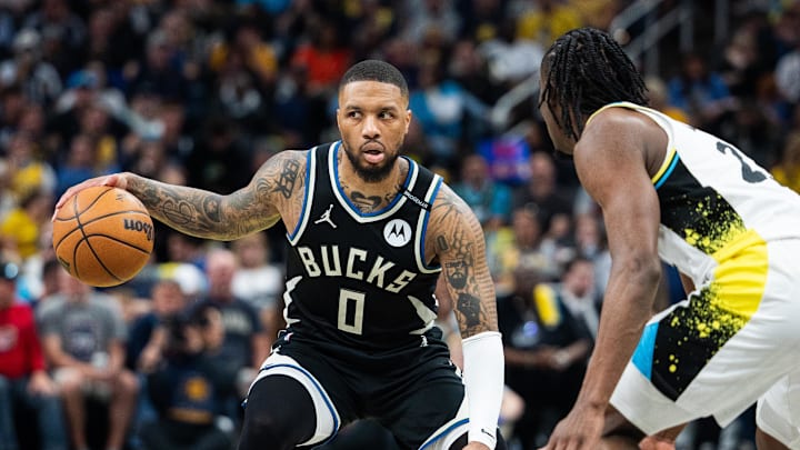 Apr 22, 2025; Indianapolis, Indiana, USA; Milwaukee Bucks guard Damian Lillard (0) dribbles the ball while Indiana Pacers forward Aaron Nesmith (23) defends during game two of first round for the 2024 NBA Playoffs at Gainbridge Fieldhouse. Mandatory Credit: Trevor Ruszkowski-Imagn Images Apr 22, 2025; Indianapolis, Indiana, USA; Milwaukee Bucks guard Damian Lillard (0) dribbles the ball while Indiana Pacers forward Aaron Nesmith (23) defends during game two of first round for the 2024 NBA Playoffs at Gainbridge Fieldhouse. Mandatory Credit: Trevor Ruszkowski-Imagn Images