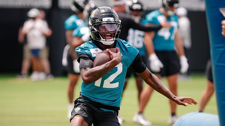 May 10, 2025; Jacksonville, FL, USA; Jacksonville Jaguars wide receiver Travis Hunter (12) runs after completing a passing drill during rookie minicamp at Miller Electric Center. Mandatory Credit: Travis Register-Imagn Images