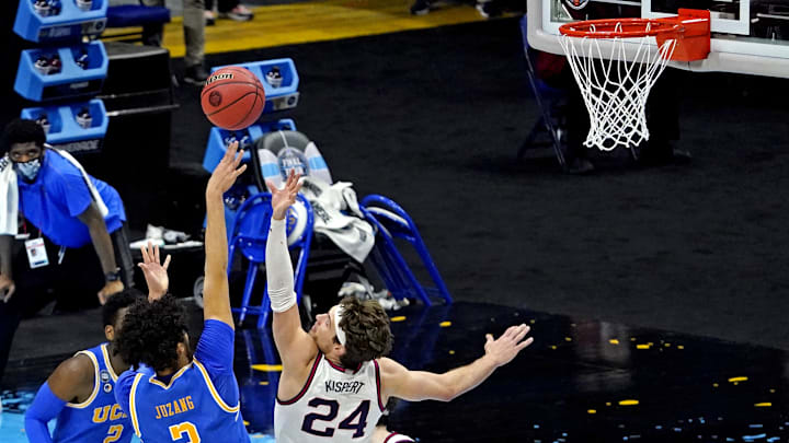 Apr 3, 2021; Indianapolis, Indiana, USA; UCLA Bruins guard Johnny Juzang (3) shoots the ball against Gonzaga Bulldogs forward Corey Kispert (24) during overtime in the national semifinals of the Final Four of the 2021 NCAA Tournament at Lucas Oil Stadium. Mandatory Credit: Robert Deutsch-Imagn Images