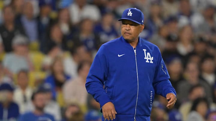 Jul 22, 2025; Los Angeles, California, USA; Los Angeles Dodgers manager Dave Roberts (30) walks on the field for a pitching change against the Minnesota Twins at Dodger Stadium. Mandatory Credit: Jayne Kamin-Oncea-Imagn Images