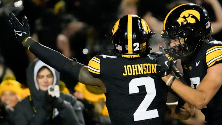 Iowa Hawkeyes running back Kaleb Johnson (2) celebrates his touchdown against the Nebraska Cornhuskers with teammate Dayton Howard (7) Friday, Nov. 29, 2024 at Kinnick Stadium in Iowa City, Iowa.