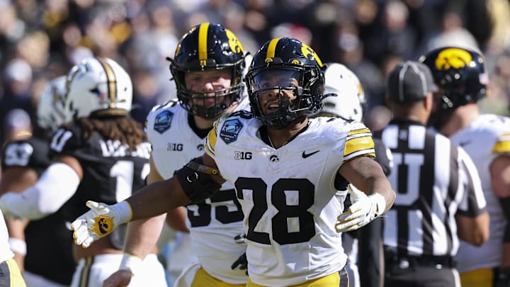 Dec 31, 2025; Tampa, FL, USA; Iowa Hawkeyes running back Kamari Moulton (28) reacts after a touchdown against the Vanderbilt Commodores in the first quarter during the ReliaQuest Bowl at Raymond James Stadium. Mandatory Credit: Nathan Ray Seebeck-Imagn Images