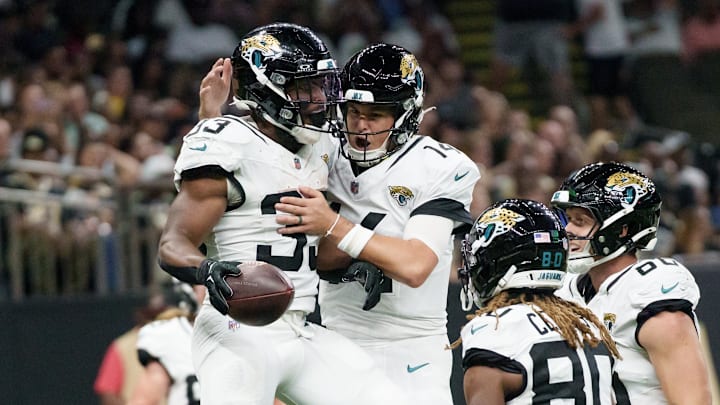 Aug 17, 2025; New Orleans, Louisiana, USA; Jacksonville Jaguars running back Bhayshul Tuten (33) celebrates a touchdown with Jacksonville Jaguars quarterback Nick Mullens (14) during the first half against the New Orleans Saints at Caesars Superdome. Mandatory Credit: Matthew Hinton-Imagn Images Aug 17, 2025; New Orleans, Louisiana, USA; Jacksonville Jaguars running back Bhayshul Tuten (33) celebrates a touchdown with Jacksonville Jaguars quarterback Nick Mullens (14) during the first half against the New Orleans Saints at Caesars Superdome. Mandatory Credit: Matthew Hinton-Imagn Images