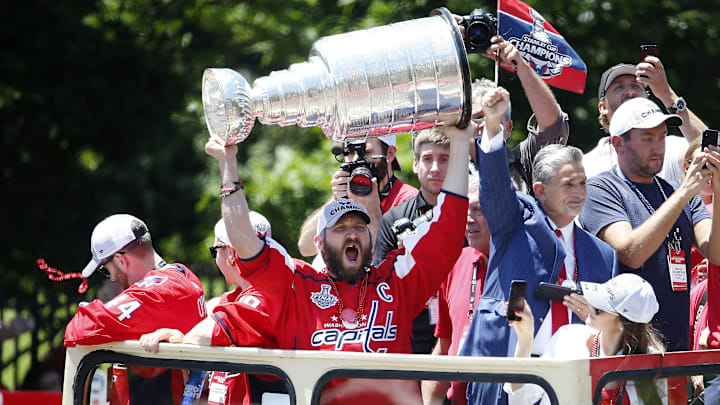 Washington left wing Alex Ovechkin hoists the Stanley Cup trophy during the NHL championship parade and celebration in 2018.