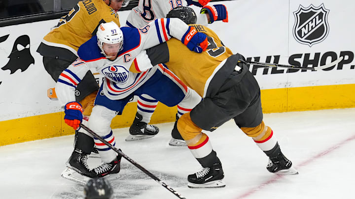 May 3, 2023; Las Vegas, Nevada, USA; Edmonton Oilers center Connor McDavid (97) attempts to skate against Vegas Golden Knights center Jack Eichel (9) during the third period of game one of the second round of the 2023 Stanley Cup Playoffs at T-Mobile Arena. Mandatory Credit: Stephen R. Sylvanie-Imagn Images May 3, 2023; Las Vegas, Nevada, USA; Edmonton Oilers center Connor McDavid (97) attempts to skate against Vegas Golden Knights center Jack Eichel (9) during the third period of game one of the second round of the 2023 Stanley Cup Playoffs at T-Mobile Arena. Mandatory Credit: Stephen R. Sylvanie-Imagn Images