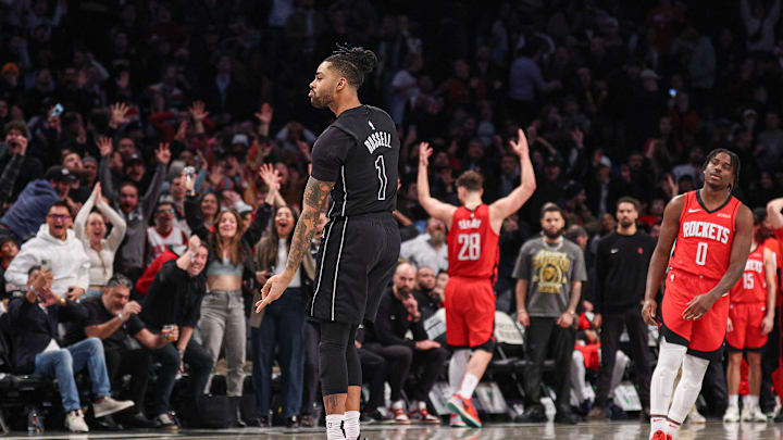 Feb 4, 2025; Brooklyn, New York, USA; Brooklyn Nets guard D'Angelo Russell (1) reacts after makes a three point basket during the fourth quarter against the Houston Rockets at Barclays Center. Mandatory Credit: Vincent Carchietta-Imagn Images