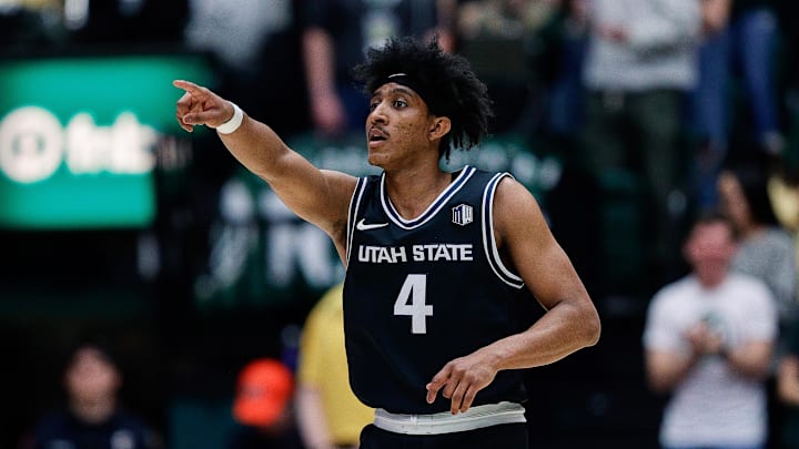Feb 17, 2024; Fort Collins, Colorado, USA; Utah State Aggies guard Ian Martinez (4) gestures in the first half against the Colorado State Rams at Moby Arena. Mandatory Credit: Isaiah J. Downing-Imagn Images