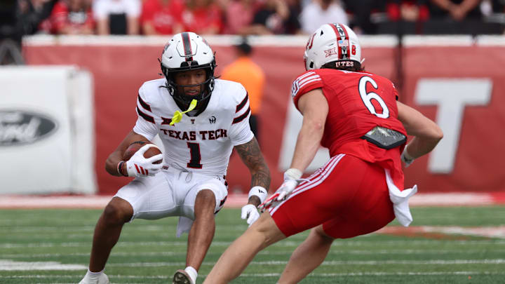 Sep 20, 2025; Salt Lake City, Utah, USA; Texas Tech Red Raiders wide receiver Reggie Virgil (1) runs after a catch against Utah Utes safety Nate Ritchie (6) during the third quarter at Rice-Eccles Stadium. Mandatory Credit: Rob Gray-Imagn Images