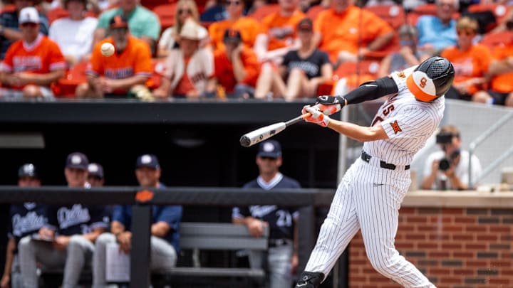 Oklahoma State outfielder Nolan Schubart (10) hits a home run during a game in the NCAA Stillwater Regional between the Oklahoma State Cowboys (OSU) and the Dallas Baptist Patriots at O'Brate Stadium in Stillwater, Okla., on Saturday, June 3, 2023. Oklahoma State outfielder Nolan Schubart (10) hits a home run during a game in the NCAA Stillwater Regional between the Oklahoma State Cowboys (OSU) and the Dallas Baptist Patriots at O'Brate Stadium in Stillwater, Okla., on Saturday, June 3, 2023.