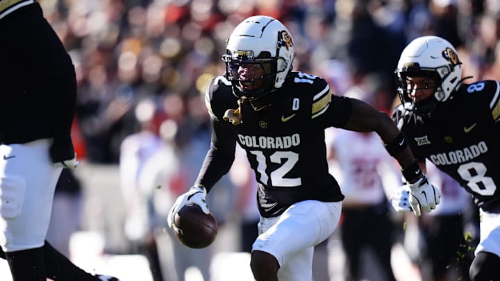 Nov 29, 2024; Boulder, Colorado, USA; Colorado Buffaloes cornerback Travis Hunter (12) following an interception in the first quarter against the Oklahoma State Cowboys  at Folsom Field. Mandatory Credit: Ron Chenoy-Imagn Images