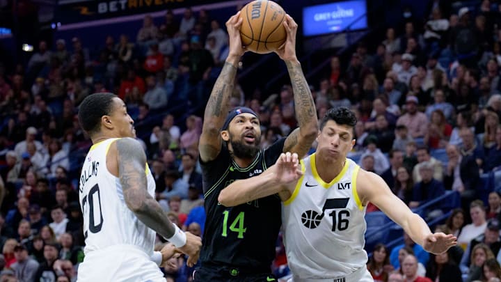 Jan 23, 2024; New Orleans, Louisiana, USA; New Orleans Pelicans forward Brandon Ingram (14) goes up to shoot against Utah Jazz forward John Collins (20) and forward Simone Fontecchio (16) during the first half at Smoothie King Center. Mandatory Credit: Matthew Hinton-Imagn Images Jan 23, 2024; New Orleans, Louisiana, USA; New Orleans Pelicans forward Brandon Ingram (14) goes up to shoot against Utah Jazz forward John Collins (20) and forward Simone Fontecchio (16) during the first half at Smoothie King Center. Mandatory Credit: Matthew Hinton-Imagn Images