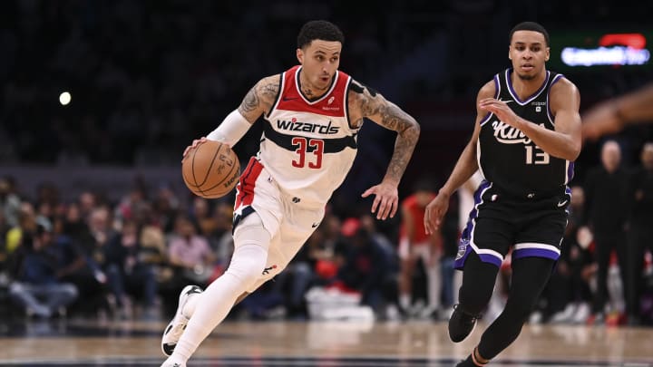 Mar 21, 2024; Washington, District of Columbia, USA; Washington Wizards forward Kyle Kuzma (33) drives to the basket as Sacramento Kings forward Keegan Murray (13) defends