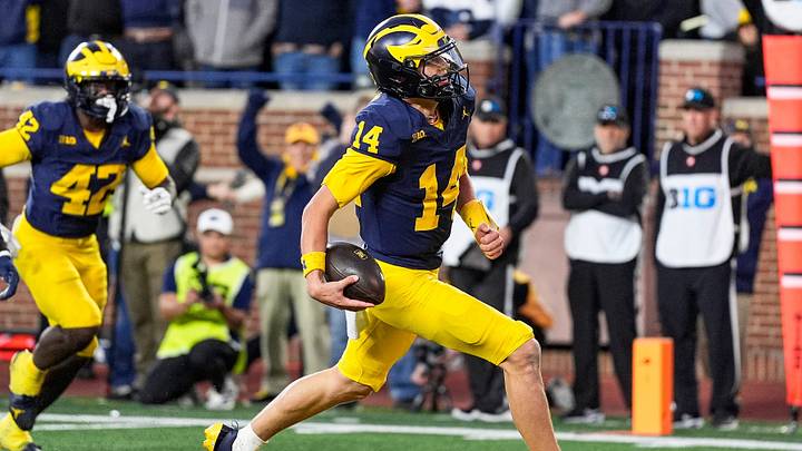 Michigan quarterback Tommy Carr (14) runs into the end zone for a touchdown against Penn State during the second half at Michigan Stadium in Ann Arbor on Saturday, Oct. 17, 2026. Michigan quarterback Tommy Carr (14) runs into the end zone for a touchdown against Penn State during the second half at Michigan Stadium in Ann Arbor on Saturday, Oct. 17, 2026.