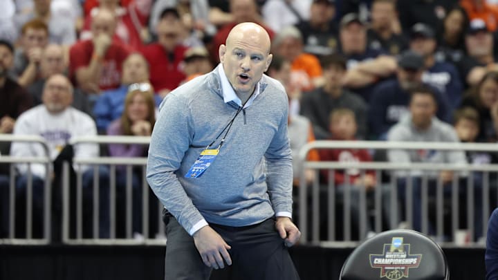 Penn State wreestling coach Cael Sanderson watches a Nittany Lions bout during the NCAA Wrestling Championships.