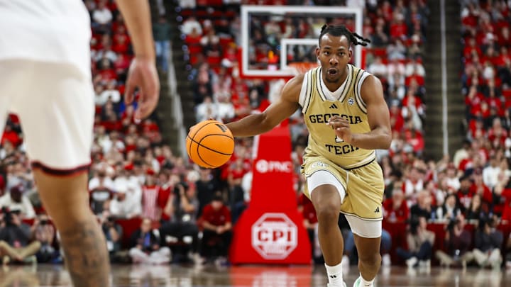 Jan 17, 2026; Raleigh, North Carolina, USA; Georgia Tech Yellow Jackets guard Lamar Washington (1) dribbles with the ball during the second half of the game against the NC State Wolfpack  at Lenovo Center. Mandatory Credit: Jaylynn Nash-Imagn Images