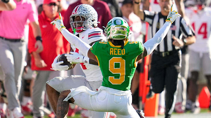 Oregon Ducks defensive back Nikko Reed (9) celebrates before realizing Ohio State Buckeyes wide receiver Jeremiah Smith (4) made a catch during the College Football Playoff quarterfinal at the Rose Bowl in Pasadena, Calif. on Jan. 1, 2025. Ohio State won 41-21.