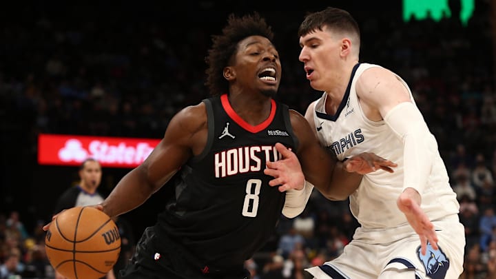 Jan 9, 2025; Memphis, Tennessee, USA; Houston Rockets forward Jae'Sean Tate (8) drives to the basket as Memphis Grizzlies forward Jake LaRavia (3) defends during the fourth quarter at FedExForum. Mandatory Credit: Petre Thomas-Imagn Images