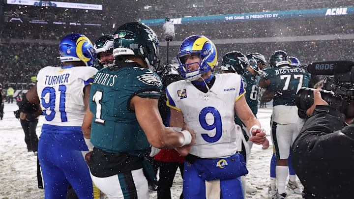 Jan 19, 2025; Philadelphia, Pennsylvania, USA; Philadelphia Eagles quarterback Jalen Hurts (1) greets Los Angeles Rams quarterback Matthew Stafford (9) after their game in a 2025 NFC divisional round game at Lincoln Financial Field. Mandatory Credit: Bill Streicher-Imagn Images