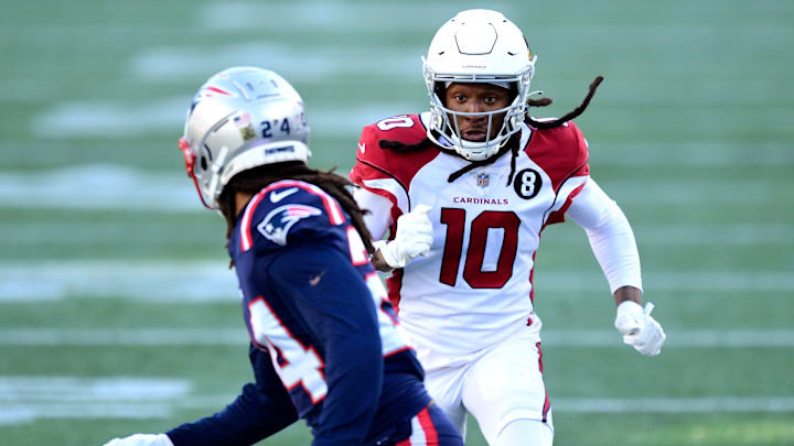 DeAndre Hopkins runs out against Stephon Gilmore in a game between the Arizona Cardinals and New England Patriots at Gillette Stadium.